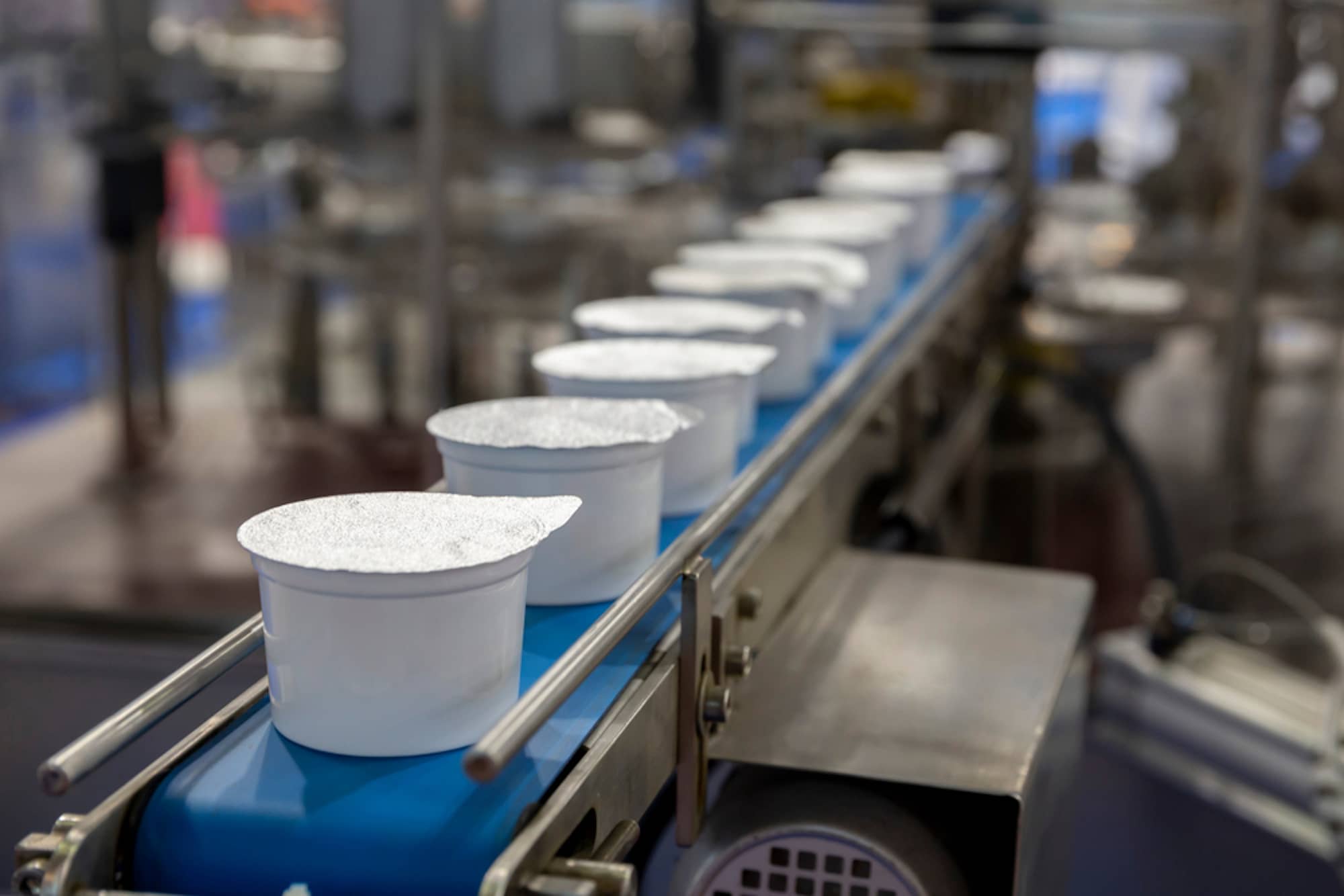 plastic containers on assembly line