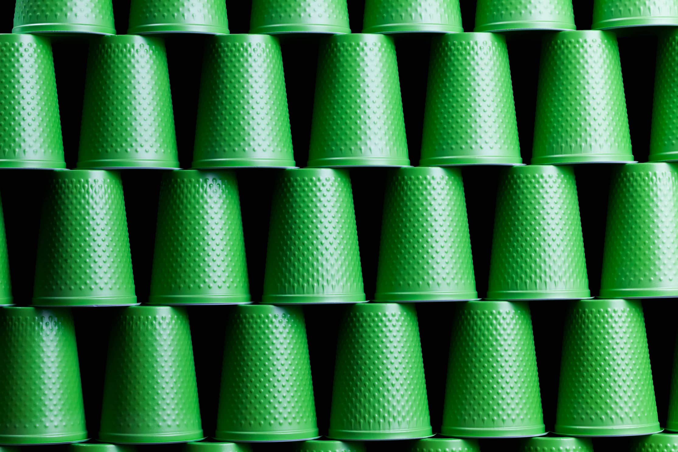 green cups with mold-tech texturing
