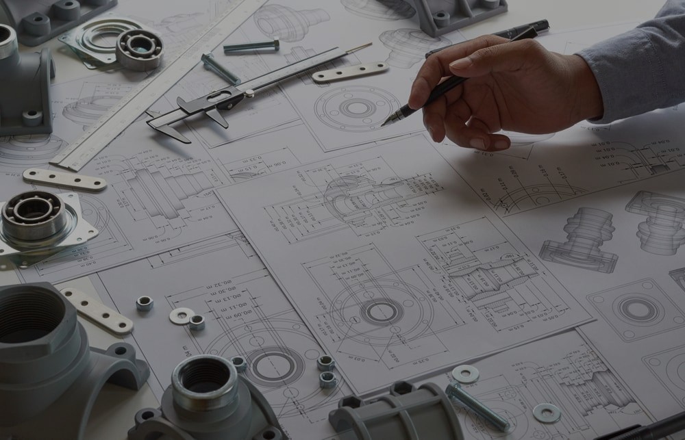 Engineer drawing designs